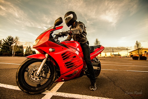 2017 a man riding in his red motorcycle in Three Bridges, New Jersey